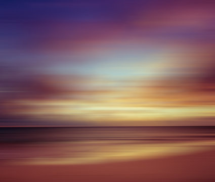 Sunset at the beach. Blurred panning motion. Abstract