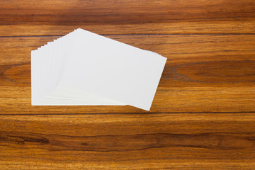 Business cards on wooden background.