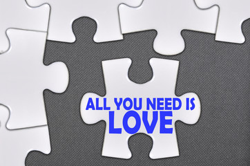 jigsaw puzzle written word all you need is love