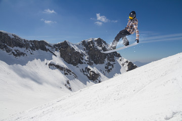 Naklejka na ściany i meble Flying skier on mountains, extreme sport