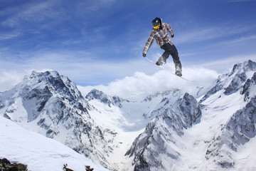 Fototapeta na wymiar Flying skier on mountains, extreme sport