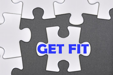Fototapeta premium jigsaw puzzle written word get fit