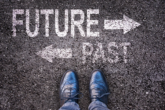 Feet And Words Future And Past Painted On An Asphalt Road