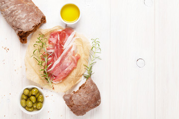 Italian prosciutto with ciabatta and olives