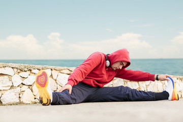 Attractive Fit Young Man Stretching Before Exercise