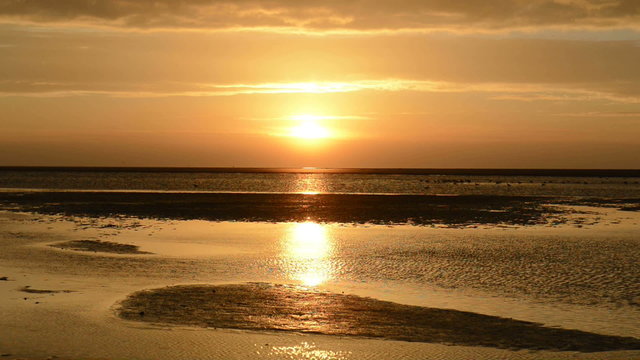 Colorful sunset over the beach at the island of Schiermonnikoog in the North of The Netherlands.