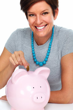 Elderly woman with piggy bank.