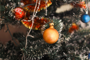 Fototapeta na wymiar Christmas-tree toy on the Christmas tree close 