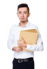 Asian Young Businessman hold with document work