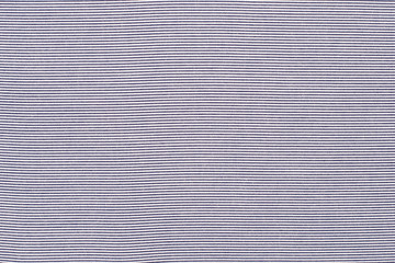 Striped blue and white textile pattern as a background. Close up on horizontal stripes material texture fabric.