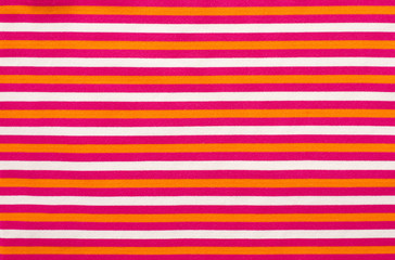 Striped pink and orange with white textile pattern as a background. Close up on horizontal stripes material texture fabric.