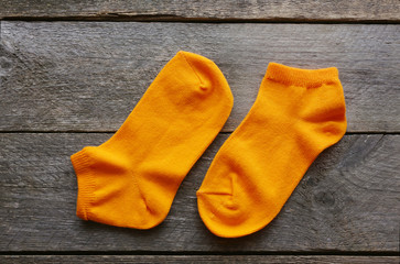 children's socks on a wooden surface