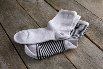 children's socks on a wooden surface