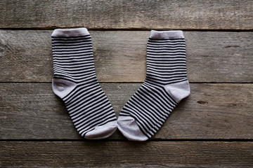 children's socks on a wooden surface