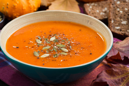 pumpkin soup in a bowl, closeup