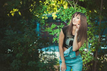 beautiful girl in denim overalls