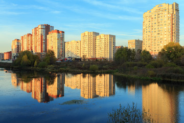 Fototapeta na wymiar New residential houses on the bank of the river Pekhorka. Balashikha. Russia