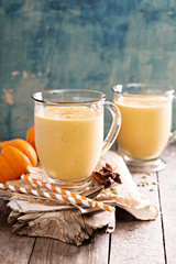 Healthy pumpkin smoothie in big mugs