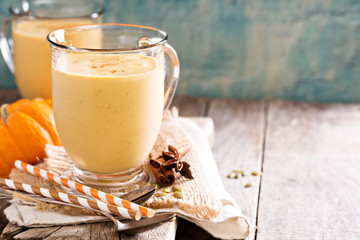 Healthy pumpkin smoothie in big mugs