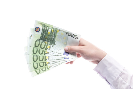 Kobieca ręka trzymająca got&oacute;wkę na białym tle