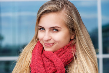Young woman smiling with winter scarf
