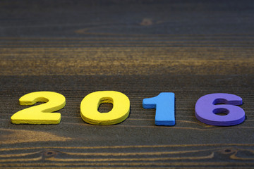 2016 year wood number in perspective wall and wooden plank