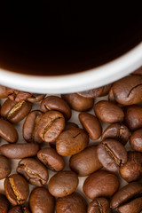 Coffee Cup and coffee beans on wooden table