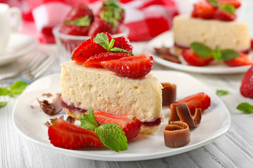 Delicious cheesecake with berries on table close up