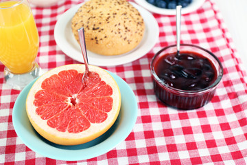 Healthy breakfast with fresh juice and grapefruit on table close up