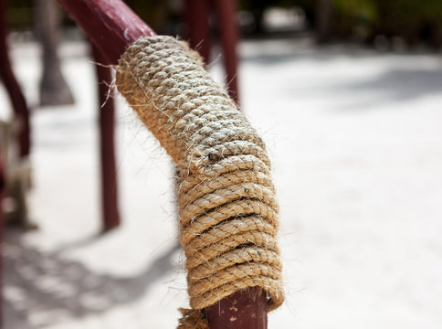 wooden structure with a thick rope closeup