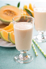 Healthy cantaloupe smoothie in a tall glass