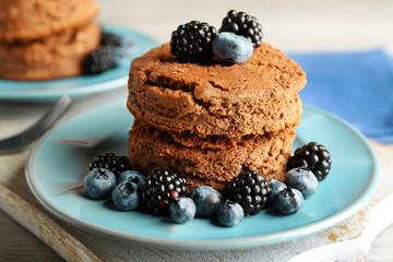 Cakes with berries on the table
