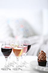 Tasting of wine and chocolate cupcakes, close up