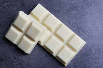 White chocolate pieces on dark gray background