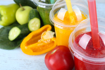 Fresh juice mix fruit, healthy drinks on color wooden background