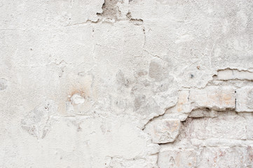 White wall with cracked plaster