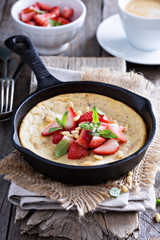 Baked pancake in cast iron pan