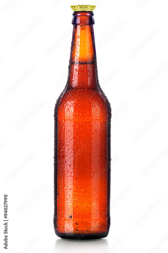 Wall mural Bottle of beer with drops isolated on white