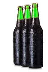 Set of beer's bottles with frosty drops isolated