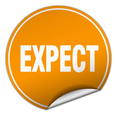 expect round orange sticker isolated on white