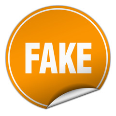 fake round orange sticker isolated on white