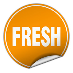 fresh round orange sticker isolated on white