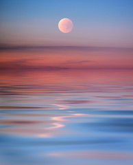 Pink moon with reflection in the sea - 94030747