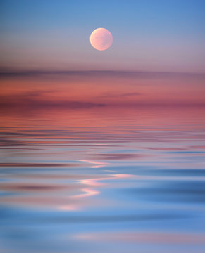 Pink Moon With Reflection In The Sea