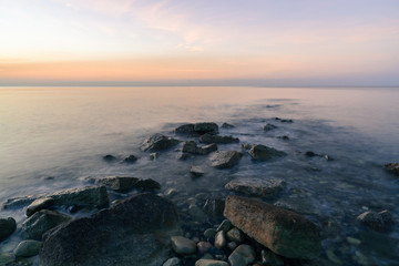 Fototapeta na wymiar Sunrise and stones .Sredizemnom sea. Limassol. Cyprus.