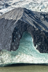 Vatnajokull glacier detail covered with volcanic ash is melting