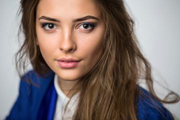 Naklejka premium Portrait of a beautiful brown-haired girl