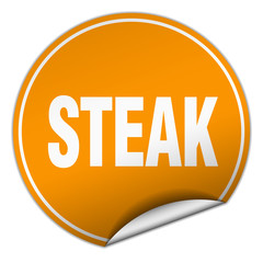 steak round orange sticker isolated on white