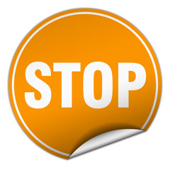 stop round orange sticker isolated on white