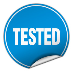 tested round blue sticker isolated on white